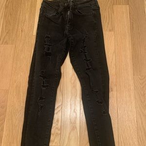 Vervet black ankle skinny jeans with rips up legs. Size 25